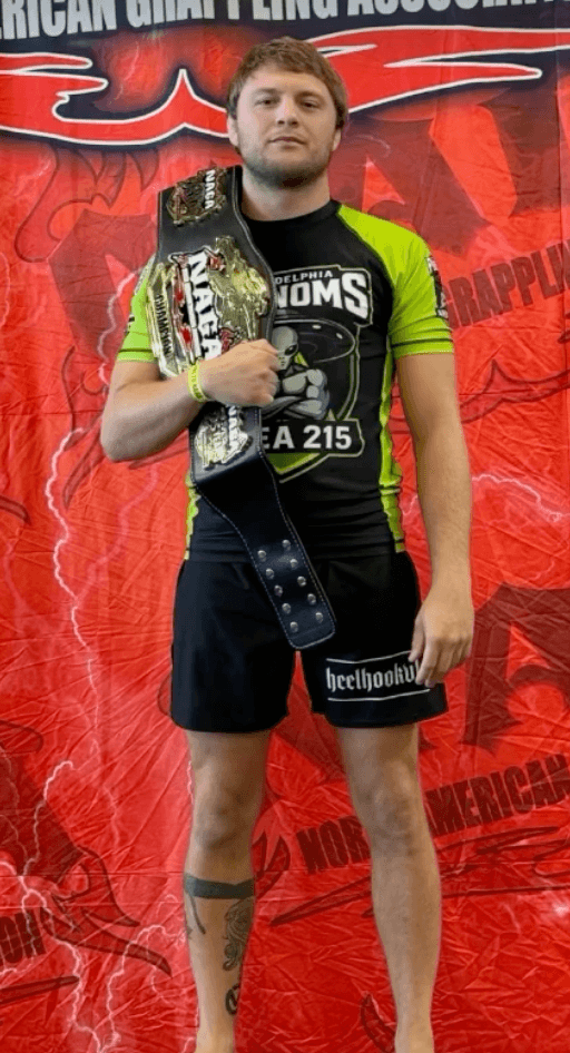 Andrew Kochel celebrates a NAGA title in Phenoms gear.